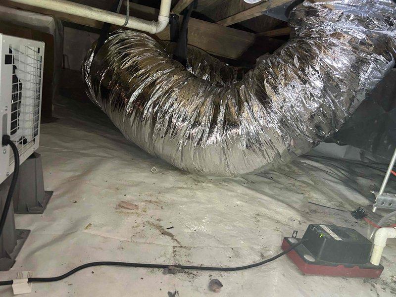 Completed installation of a RUUD 2.5-ton 14.3 SEER2 Two Stage Heat Pump system with matching air handler and 10KW heat kit in residential property. Work included replacing existing 14" flex return with new 16" foil flex, installing condensate safety sensor, repairing dryer vent in crawl space, and connecting to existing ductwork with proper transitions. System is fully operational with all manufacturer-specified components installed according to code requirements.