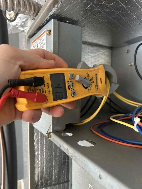 Performed Care Plan Tune Up on heat pump/air handler system located in garage. Conducted electrical testing of system components with multimeter, showing readings within normal parameters (0.3). Inspected evaporator coil which showed minor dust accumulation but remains in serviceable condition. Filter replacement not included in service.