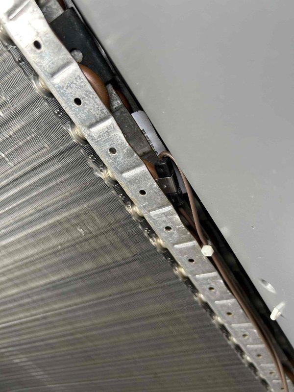 Responded to no heat call for guest house heat pump system. Upon inspection, discovered ice/frost accumulation on evaporator coil. Advised system shutdown to allow complete defrost before further diagnostics could be performed to identify underlying cause of freezing condition.