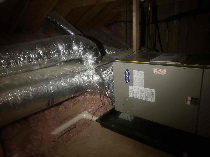 Responded to a no-heat service call for a Payne heat pump system with Carrier air handler. Diagnosed electrical failure at outdoor unit preventing compressor operation. Replaced failed capacitor and contactor, restored power flow, and verified proper operation in heating mode. System now functioning properly with normal temperature differential across coils.