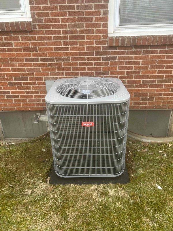 Completed installation of a Bryant full system including GA5SAN53000W air conditioner, CVAMA3017XMA coil, and 912SE48080M17 furnace with new condensation pump and S200 thermostat. System was properly mounted on concrete pad with all required components installed including electrical connections, refrigerant lines, safety sensors, and proper drainage setup according to code requirements.
