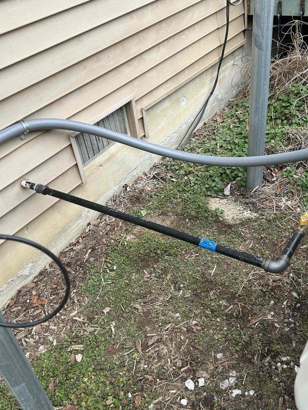 Successfully installed new gas piping from the house exterior to the outdoor generator. Installed black pipe with appropriate fittings and connections, ensuring proper placement over foundation area with adequate clearance. Completed all connections to generator unit, installed required valve, and verified system integrity through pressure testing.