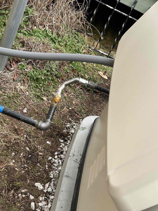 Successfully installed new gas piping from the house exterior to the outdoor generator. Installed black pipe with appropriate fittings and connections, ensuring proper placement over foundation area with adequate clearance. Completed all connections to generator unit, installed required valve, and verified system integrity through pressure testing.