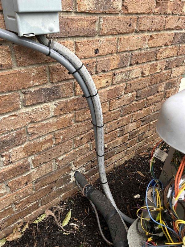 Responded to callback for inoperative heating system with blank display. Traced issue to disconnected electrical wiring at outdoor unit, likely caused by recent service. Reconnected and secured all wiring connections in the conduit running from junction box to HVAC unit, restoring system functionality.