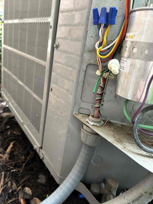 Responded to callback for inoperative heating system with blank display. Traced issue to disconnected electrical wiring at outdoor unit, likely caused by recent service. Reconnected and secured all wiring connections in the conduit running from junction box to HVAC unit, restoring system functionality.