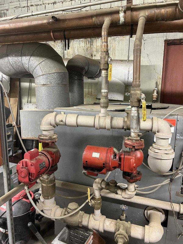 Responded to water leak service call for commercial boiler system. Upon inspection, identified leaking circulation pump within complex hydronic network. Replaced faulty pump seals and verified proper operation of the system with no further leakage detected.