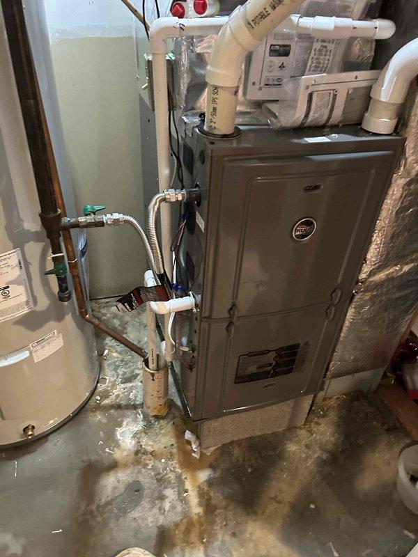 Successfully installed a Ruud 96% efficient 70K BTU two-stage gas furnace (model R962V0703A17M4SCAP) with PVC venting in the utility room, retaining the existing thermostat. System includes lifetime heat exchanger warranty, 10-year parts warranty, and 1-year labor warranty with maintenance plan.