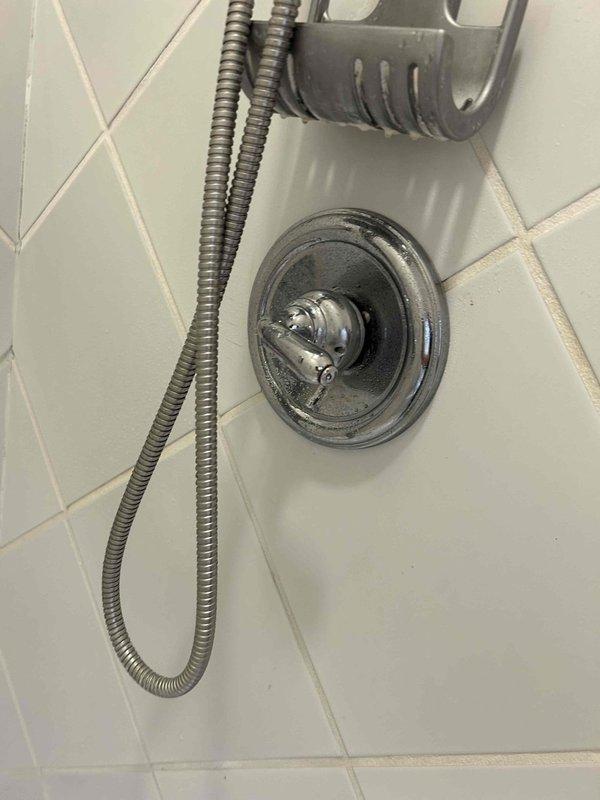 Diagnosed and repaired a leaking shower handle by accessing the valve assembly through the wall. Observed significant oxidation and corrosion on the copper supply pipes and valve components, which were contributing to the leak. Replaced damaged components, reassembled the fixture, and verified proper operation with no further leakage.