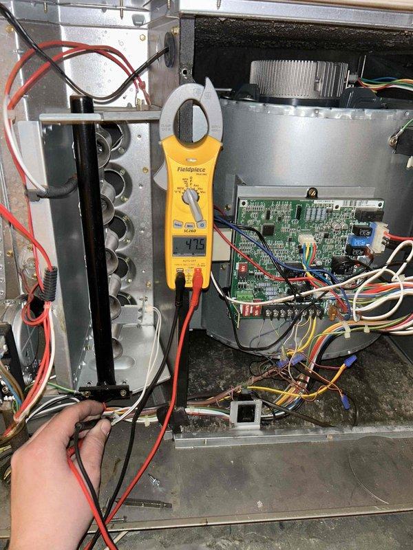 Performed annual maintenance on 10-year-old AC system. Conducted electrical diagnostic testing with Fieldpiece meter, measuring amperage draw (11.5) and voltage (1.13) at circuit board connections. System is functioning properly with all components in normal operating condition.