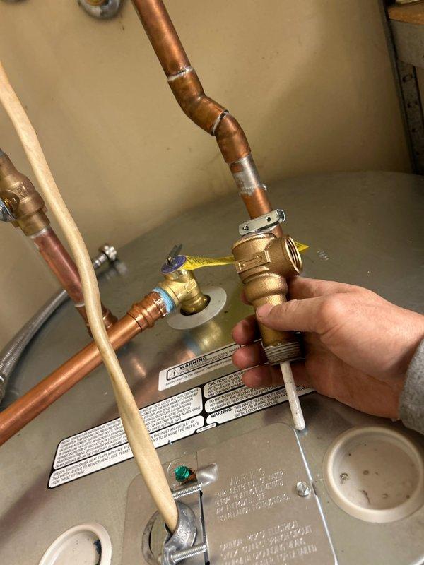 Responded to callback regarding water heater installed one month prior that was not heating properly and producing loud noise. Inspection revealed problems with the copper pipe connections to the water heater. Repaired faulty soldering at multiple connection points and properly secured brass valve fittings, resolving both the heating malfunction and noise issue.