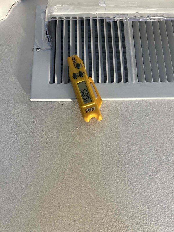 Performed warranty compressor replacement and leak repair on HVAC system. Conducted refrigerant leak detection (471 ppm with -8.4/min rate) and verified proper system operation post-repair with supply air temperature reading 56.5°F through register.