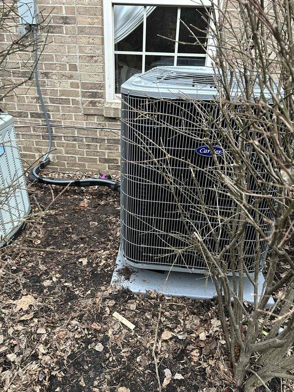 Successfully installed complete Carrier heat pump system (model CE27SCA530A003) with air handler (model CEFJ5ANXB30L00) and 10KW heat kit. Installation included outdoor unit placement on concrete pad with protective features (snow legs, disconnect box, refrigerant line filter) plus interior air handler setup with safety features (SS2 coil drain sensor, overflow pan with water sensor) and connection to existing ductwork and media filter cabinet as requested by customer.