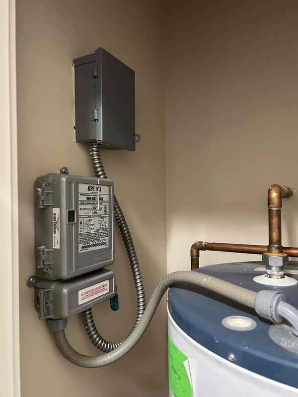 Inspected existing 87-gallon water heater system for potential replacement. Disconnected water line from refrigerator as customer is transitioning to a non-ice maker model. Coordinated with on-site electrician regarding customer's conversion from gas to induction cooking appliance.