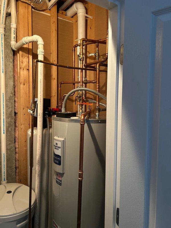 Repaired small leak in master bathroom shower wand and performed comprehensive assessment of plumbing system for potential installation of water leak/freeze detection shut-off valve. Inspected existing water heater installation and main plumbing infrastructure to determine compatibility and requirements for automated shut-off system.