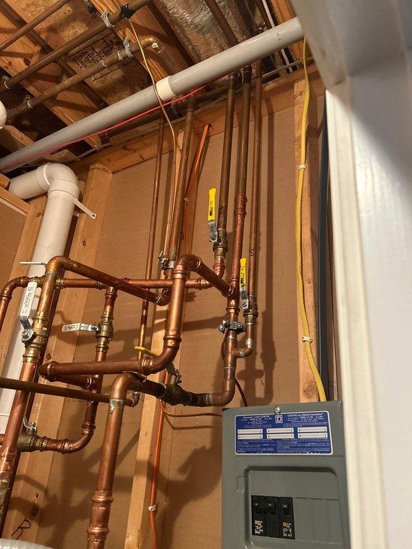 Repaired small leak in master bathroom shower wand and performed comprehensive assessment of plumbing system for potential installation of water leak/freeze detection shut-off valve. Inspected existing water heater installation and main plumbing infrastructure to determine compatibility and requirements for automated shut-off system.