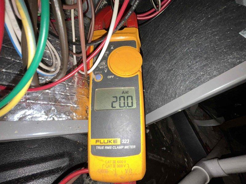 Performed annual Care Plan Tune Up on heat pump/air handler system located in attic. Conducted electrical testing using Fluke 323 clamp meter, measuring amperage draw (2.00A) and voltage (190V) at control board. Inspected internal components and wiring connections to ensure proper operation of system.