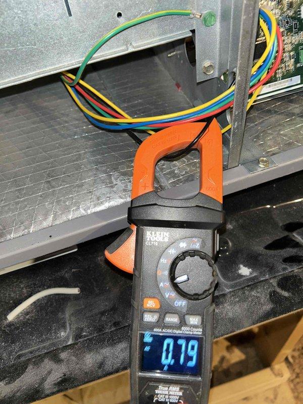 Performed scheduled maintenance service on four heat pump systems as part of planned service agreement. Conducted electrical current measurements on multiple circuits using clamp meter, with readings of 0.79A and 20.57A recorded during diagnostics. Systems were located in closets and attic spaces, requiring ladder access for complete inspection and service.