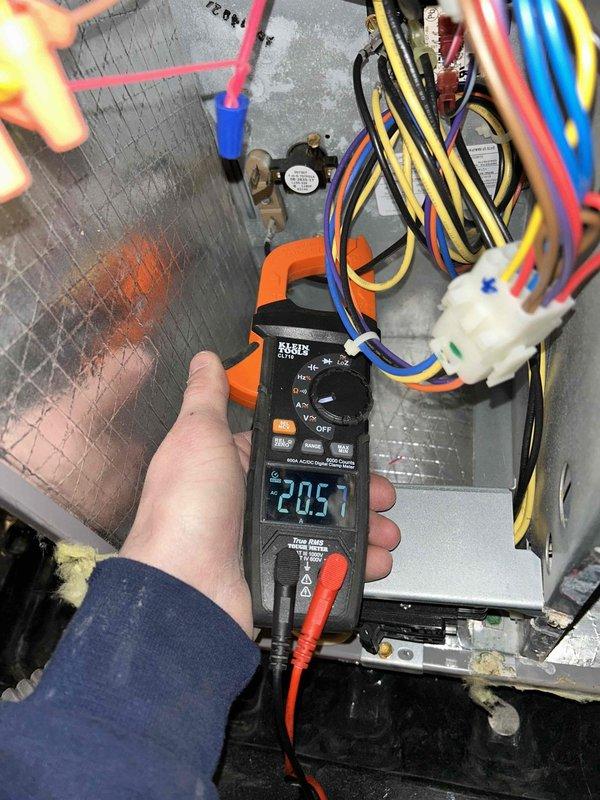 Performed scheduled maintenance service on four heat pump systems as part of planned service agreement. Conducted electrical current measurements on multiple circuits using clamp meter, with readings of 0.79A and 20.57A recorded during diagnostics. Systems were located in closets and attic spaces, requiring ladder access for complete inspection and service.