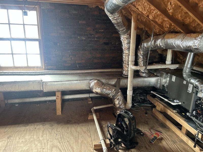 Performed comprehensive maintenance on three HVAC systems (12 years old) located in attic, basement, and apartment above garage. Inspected electrical connections, ductwork integrity, and system components in all three units, noting well-maintained reflective insulation on attic ductwork. Replaced 14x20x1 disposable filter as part of routine service; advised client regarding future GreenPac filter requirements.