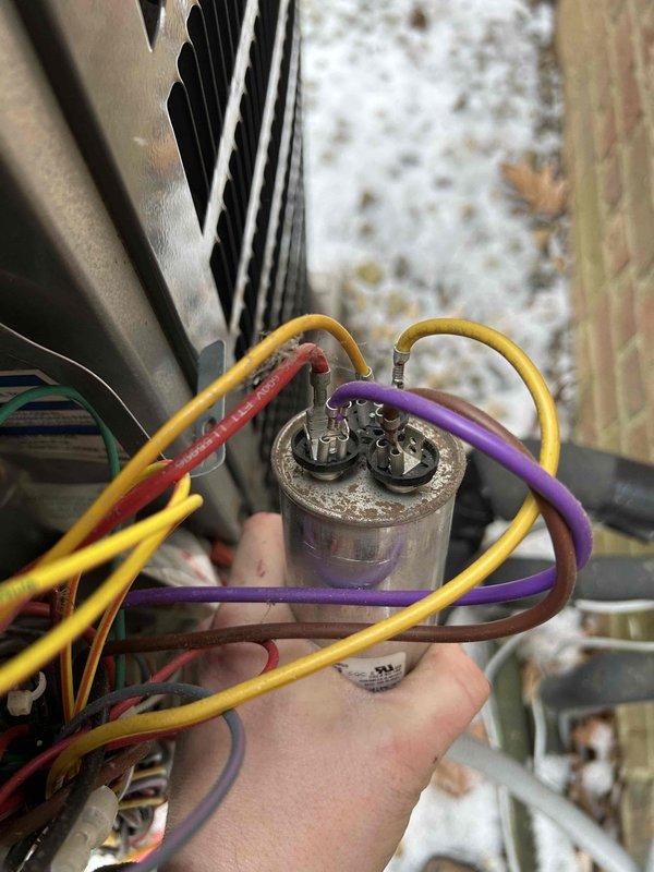 Performed scheduled care plan tune-up on Goodman heat pump system. Inspected outdoor unit and found capacitor showing signs of corrosion; replaced capacitor and reconnected wiring properly. System now operating within normal parameters.