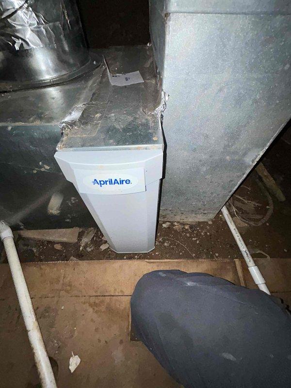 Responded to customer callback request to replace #410 filter which was not changed during previous maintenance visit. Upon inspection, found AprilAire humidifier system connected to the HVAC ductwork with normal dust accumulation in the mechanical area. Removed existing filter from vertical compartment and installed new #410 replacement filter per manufacturer specifications.