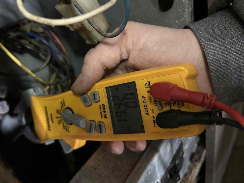 Performed scheduled Club Trio maintenance on heat pump and dual air handlers located in attic, laundry room, and basement after 1pm as requested. Conducted electrical diagnostics with multimeter showing 35.5V reading and inspected valve assembly and plumbing components. Customer-supplied filters were installed during the comprehensive system tune-up.