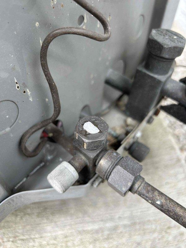 Performed scheduled Club Trio maintenance on heat pump and dual air handlers located in attic, laundry room, and basement after 1pm as requested. Conducted electrical diagnostics with multimeter showing 35.5V reading and inspected valve assembly and plumbing components. Customer-supplied filters were installed during the comprehensive system tune-up.