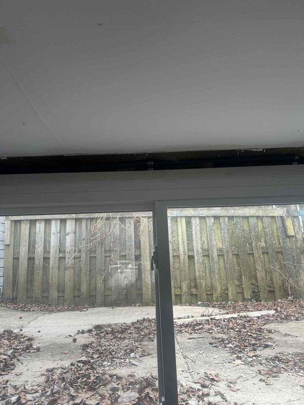 Successfully installed protective conduit strapping along the window frame to secure existing cable run. Verified installation integrity and proper cable protection at all attachment points. Key was returned to mailbox upon completion.