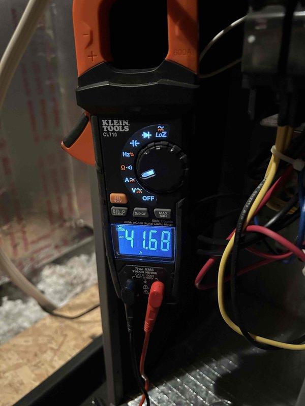 Performed routine Club Duo maintenance on HP/AH and AC/GF units located in attic and basement. Conducted electrical testing with clamp meter showing 41.68A reading and inspected the DiversiTech disconnect box mounted on exterior brick wall, confirming proper installation and functionality of all components.