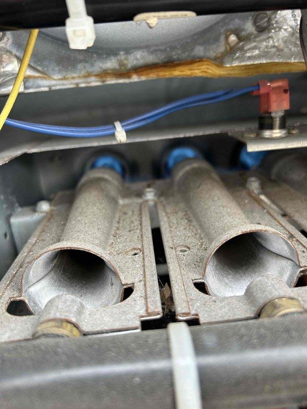 Performed scheduled Care Plan Tune Up on gas package unit including inspection of electrical components with voltage readings (5.29V AC) using Fieldpiece SC440 meter. Examined burner assembly showing normal oxidation with proper flame pattern and verified gas manifold integrity. Customer-supplied bag filter and pre-filter were installed and system was returned to proper operating condition.