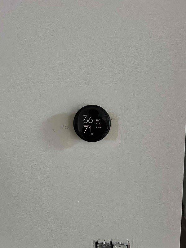 Responded to a no-heat call for a system less than one year old. Diagnosed thermostat wiring issue causing improper communication between the thermostat and furnace. Rewired connections, verified proper operation with the digital display now showing correct temperature readings (66°F current, 71°F set point), and confirmed system is now heating properly.