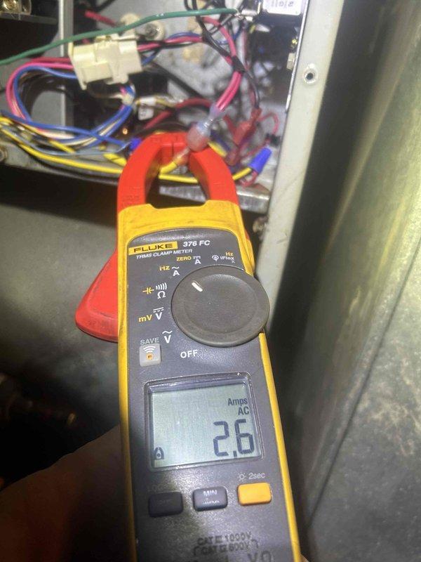 Performed scheduled Care Plan Tune-Up on heat pump/air handler system located in basement closet. Conducted electrical testing using Fluke 376 FC clamp meter, measuring 2.6 Amps AC during operation. Inspected ventilation components and noted moderate dust accumulation on fan assembly requiring standard cleaning.