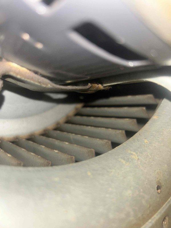 Performed scheduled Care Plan Tune-Up on heat pump/air handler system located in basement closet. Conducted electrical testing using Fluke 376 FC clamp meter, measuring 2.6 Amps AC during operation. Inspected ventilation components and noted moderate dust accumulation on fan assembly requiring standard cleaning.