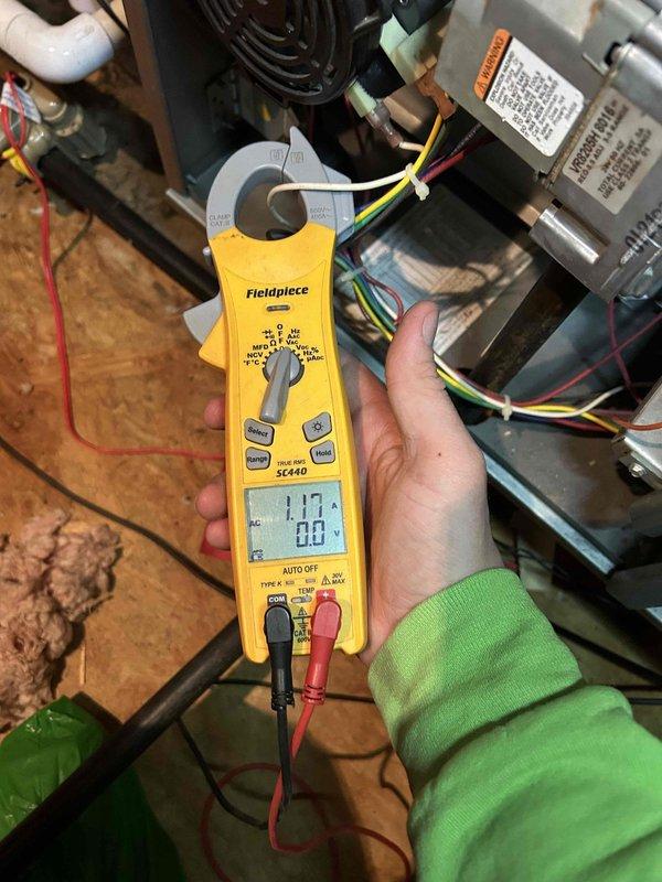 Performed scheduled Care Plan Tune Up on dual AC/GF systems located in attic. Conducted electrical amperage measurements on system components using Fieldpiece SC440 clamp meter, confirming proper operation with readings of 1.17A. Inspected gas furnace burner assembly, verifying proper ignition and flame pattern across all burners. Cleaned washable filters as per maintenance protocol.