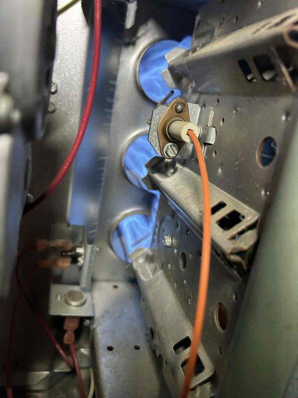 Performed scheduled Care Plan Tune Up on dual AC/GF systems located in attic. Conducted electrical amperage measurements on system components using Fieldpiece SC440 clamp meter, confirming proper operation with readings of 1.17A. Inspected gas furnace burner assembly, verifying proper ignition and flame pattern across all burners. Cleaned washable filters as per maintenance protocol.