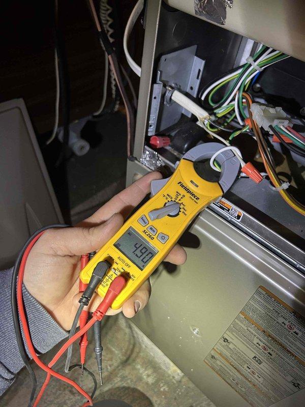 Performed Care Plan Tune Up on AC/gas furnace system with 16x25x1 filter. Conducted amperage testing on HVAC electrical components with readings of 4.90 amps, confirming proper operation within manufacturer specifications. Verified thermostat functionality, which displayed proper temperature control at 74°F with heat mode and auto fan settings operating correctly.