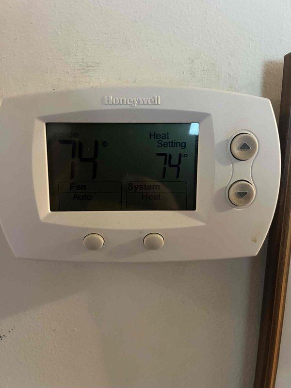 Performed Care Plan Tune Up on AC/gas furnace system with 16x25x1 filter. Conducted amperage testing on HVAC electrical components with readings of 4.90 amps, confirming proper operation within manufacturer specifications. Verified thermostat functionality, which displayed proper temperature control at 74°F with heat mode and auto fan settings operating correctly.