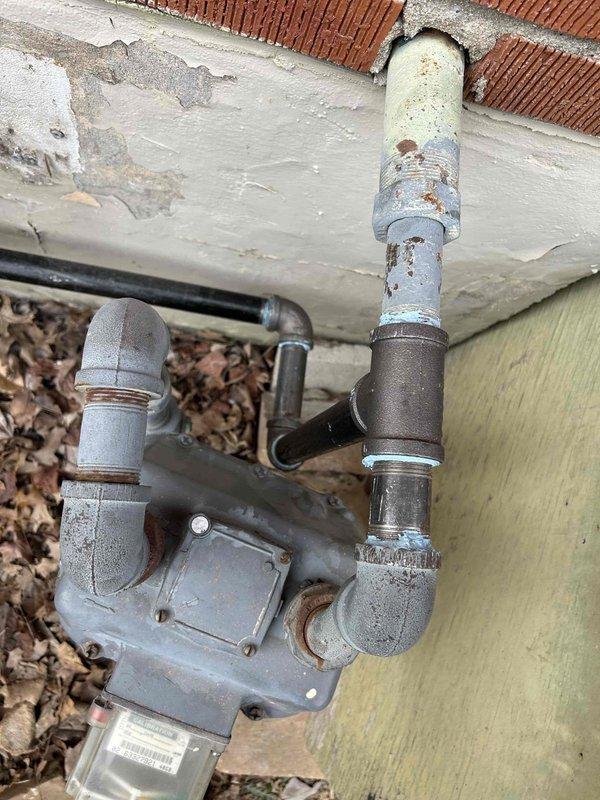 Completed installation of a Lennox 2-ton 70K BTU Gas Package Unit (LRP13GEK24-072EP), connecting to existing supply duct in crawl space while installing two return runs with floor grilles (14x8). Removed old gas furnace and evaporator coil, boarded up floor opening, and installed digital thermostat with all necessary components including outdoor unit pad, electrical connections, and SS2 coil drain safety water sensor; gas line connection to be completed on Tuesday as scheduled.
