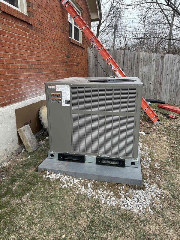 Completed installation of a Lennox 2-ton 70K BTU Gas Package Unit (LRP13GEK24-072EP), connecting to existing supply duct in crawl space while installing two return runs with floor grilles (14x8). Removed old gas furnace and evaporator coil, boarded up floor opening, and installed digital thermostat with all necessary components including outdoor unit pad, electrical connections, and SS2 coil drain safety water sensor; gas line connection to be completed on Tuesday as scheduled.