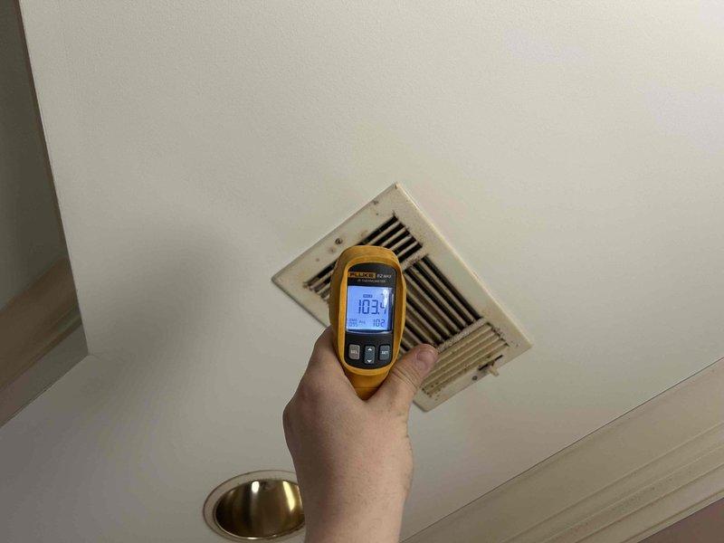 Responded to no heat service call for 7-year-old geothermal system with blank thermostat. Verified system was functioning properly as temperature readings at supply vents showed 103.4°F, indicating normal operation. Diagnosed and replaced faulty Trane thermostat which had failed completely, restoring proper system control and heat to the residence.