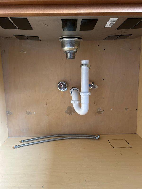 Completed rough-in installation for dog wash station and utility room sink in garage, which included cutting drywall, installing new 1 1/2" drain lines with studor vents, and connecting to existing 3" sewer line in crawl space. Successfully ran new 1/2" PEX water supply lines from existing 3/4" PEX in crawl space to service both fixtures, and verified proper functionality of all installed components prior to departure.