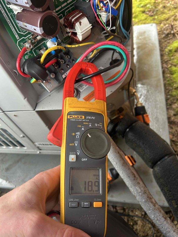 Performed Care Plan Tune Up on heat pump and air handler located in basement. Conducted electrical diagnostics using Fluke 376 FC clamp meter, recording readings of 18.9 and 2.3 on system components. Inspected circuit board, terminal connections, and verified proper operation of all electrical components.