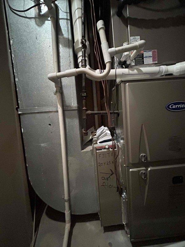 Successfully installed a Carrier 100K BTU Two-Stage 97% efficient gas furnace (model 59TP7A100V21-20) with proper connection to existing flue piping and electrical components. Verified system operation with temperature testing showing proper airflow at 77.9°F, and re-insulated outdoor suction line while maintaining connection to existing thermostat.