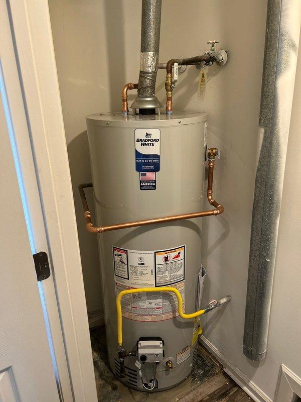 Successfully removed and disposed of existing water heater and installed new Bradford White 50-gallon short water heater. Connected unit to existing water piping and electrical service, ensuring proper venting with galvanized ducts. Verified proper combustion and functionality before completion; system now operating with clean blue flame and no leaks.