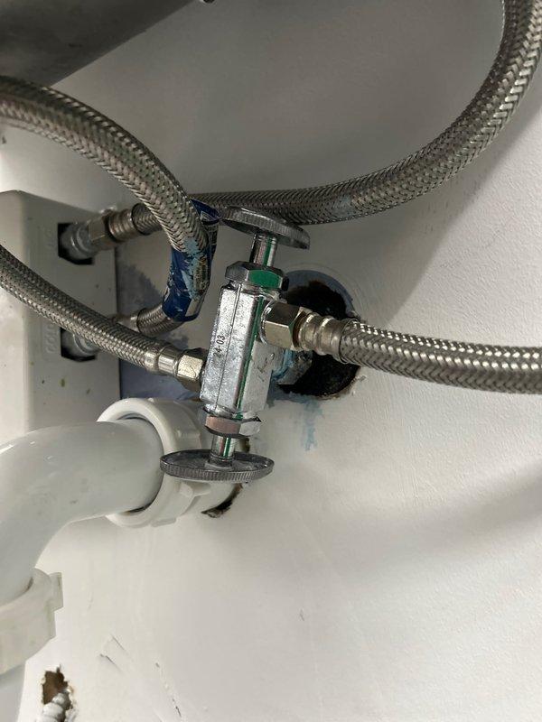 Responded to urgent plumbing issues at stadium facility, inspecting and servicing multiple water supply connections including braided stainless steel flex lines and associated valves. Repaired ZURN flush valve mechanism on commercial toilet fixture, replacing worn components to restore proper flushing operation.
