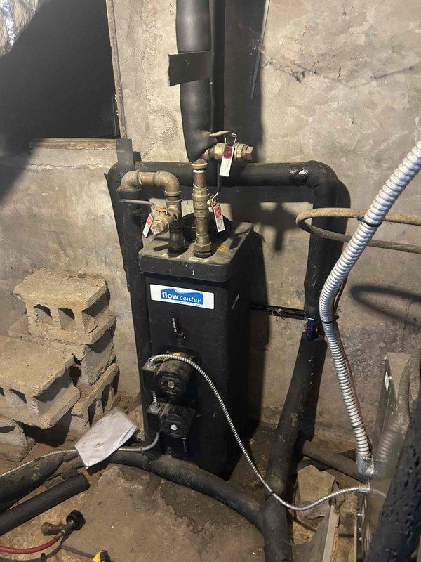 Performed scheduled Care Plan Tune Up on dual geothermal split systems located in basement and attic. Inspected Flow Center components in basement, noting proper operation with no concerning wear or leakage at connection points. Replaced customer-supplied air filters (29.5x31.5x2 and 19.875x21.5x1) and documented system condition with photos for service records.