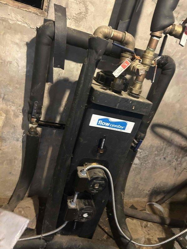 Performed scheduled Care Plan Tune Up on dual geothermal split systems located in basement and attic. Inspected Flow Center components in basement, noting proper operation with no concerning wear or leakage at connection points. Replaced customer-supplied air filters (29.5x31.5x2 and 19.875x21.5x1) and documented system condition with photos for service records.