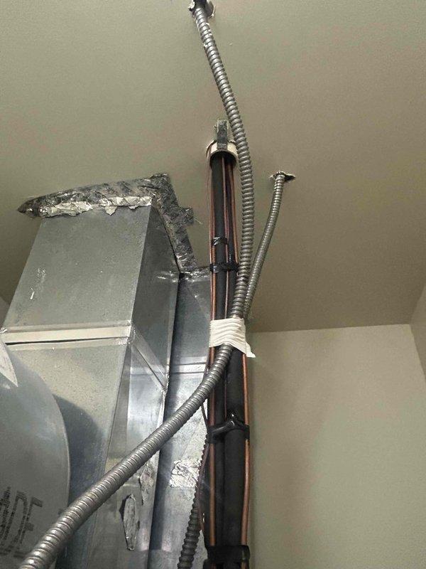 Responded to no-heat call for 15-year-old heat pump system with rooftop air handler. Upon inspection of the RTU, discovered failed compressor as previously diagnosed. Examined electrical control panel components and inspected refrigerant lines and electrical conduits for proper installation. Replaced compressor and restored system operation to manufacturer specifications.