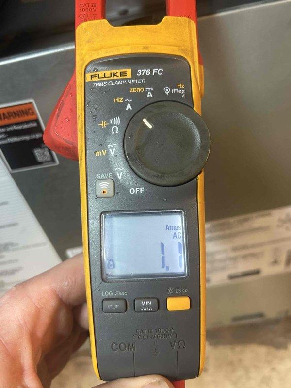 Performed routine maintenance on dual HVAC system with heat pump/air handler and AC/gas furnace units located in basement and attic (accessed via pull-down ladder). Conducted electrical testing with Fluke 376 FC True RMS Clamp Meter, confirming proper amperage draw of 1.1 Amps AC. Customer supplies 14x25x1 filters; verified equipment identification and inspected copper refrigerant lines for proper condition.