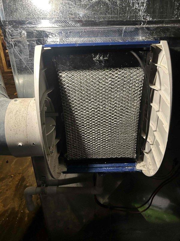 Performed scheduled Care Plan maintenance on dual HVAC system (2 air conditioners/2 gas furnaces) located in basement. Completed comprehensive tune-up service including inspection and cleaning of components. Replaced both #410 humidifier filters as part of annual spring maintenance on 8-year-old system.